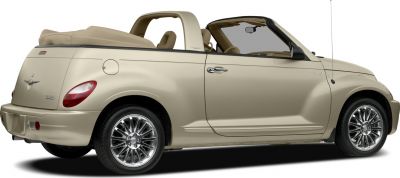 Beige convertible with retractable soft top and retro styling.