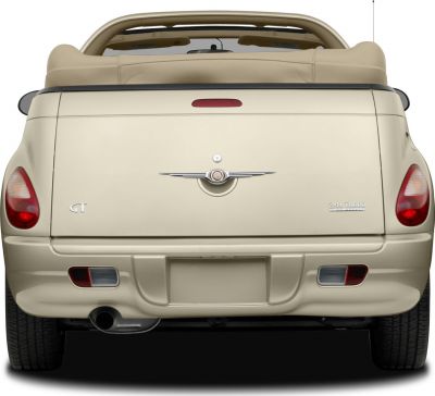 Rear view of convertible with soft top and turbo badge