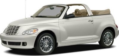 Front side view of a white convertible with open roof and distinctive grille.