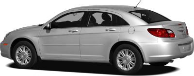 Silver four-door sedan side rear view with alloy wheels and distinctive taillights