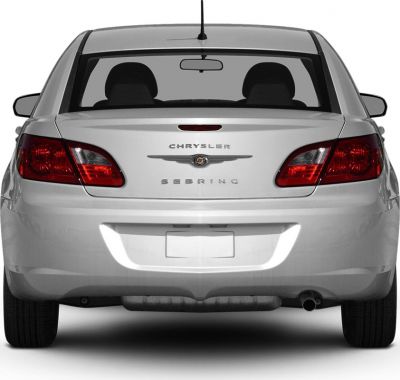Rear view showing tail lights, trunk, rear bumper, and exhaust pipe