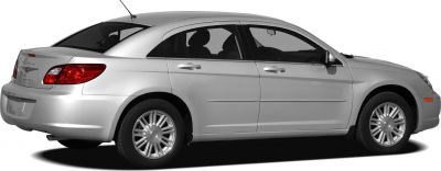 Silver mid-size sedan viewed from rear side with alloy wheels