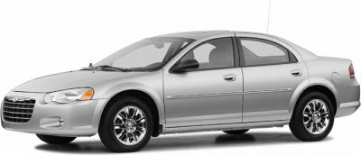 Silver four-door sedan with chrome alloy wheels and smooth body