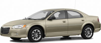 Side view of sedan with chrome alloy wheels and smooth aerodynamic design