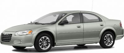 Silver four-door sedan side profile with chrome alloy wheels