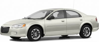 Side profile of mid-size sedan with chrome alloy wheels.