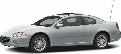 Silver two-door coupe with alloy wheels and sleek side body design