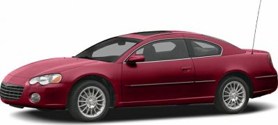 Red two-door coupe with alloy wheels and sleek sedan profile