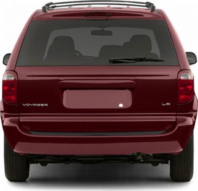 Rear view of a minivan with tinted rear window and roof rails