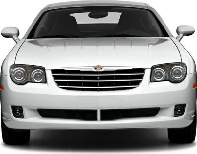 Front view showing distinctive grille and dual round headlights.