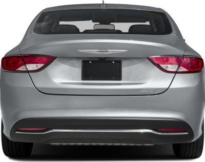 Rear view of car with distinct tail lights, trunk, and bumper design