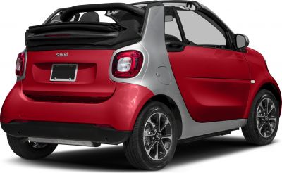 Rear view of compact convertible with folded soft top and distinctive rear lights