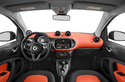 Dashboard with circular air vents and two-tone seating upholstery