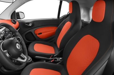 Black and orange fabric seats with matching door panel and dashboard accents.