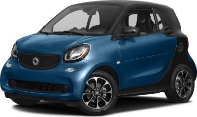 Front side view with distinctive grille, headlights, and alloy wheels