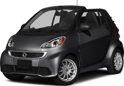 Compact convertible two-seater car with open roof and distinctive front design