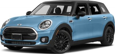 Front-side view with round headlights, black roof, and alloy wheels