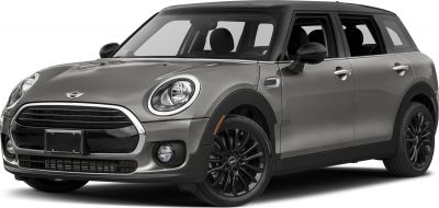 Front 3-quarter view showing round headlights and black alloy wheels