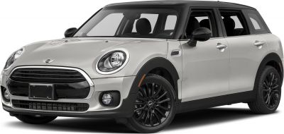 Front side angle showing black alloy wheels and round headlights.