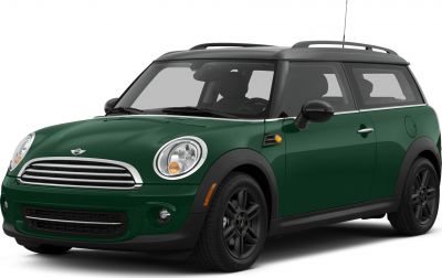 Classic green compact wagon with black roof and distinctive front grille.