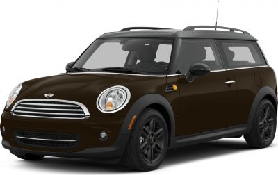 Front side view with round headlights and black alloy wheels