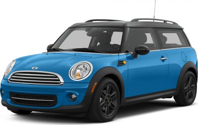 Front-angle view of a compact blue wagon with black roof and round headlights