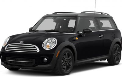 Front side view with distinctive headlights and roof rails of a compact vehicle