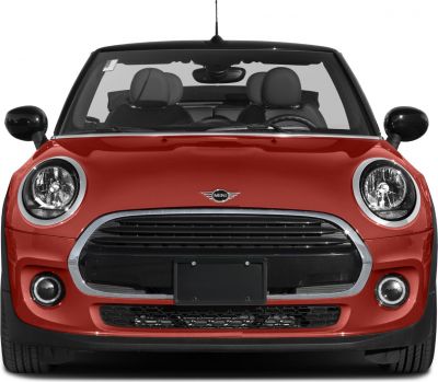 Front view showing round headlights and large grille