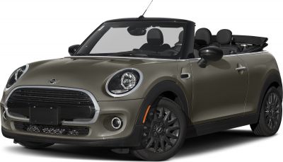 Retractable soft top and rounded headlights on a sleek two-door convertible.