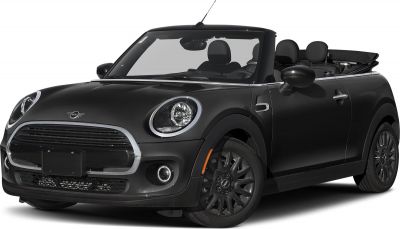 Open-top compact convertible with round headlights and black detail accents.