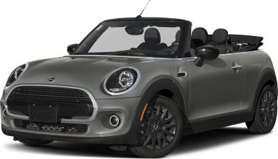 Front-side view of a compact convertible with round headlights and black wheels.