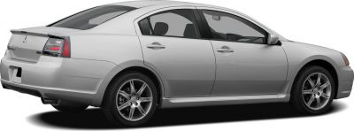 Rear side profile with silver alloy wheels and aerodynamic sedan design