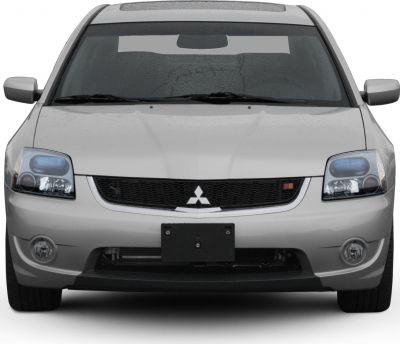 Front view with headlights, grille, and fog lights