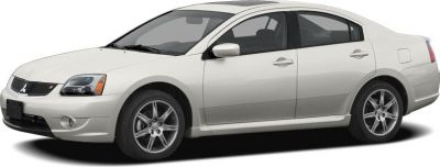 White four-door sedan with alloy wheels and aerodynamic shape