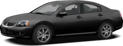 Sleek front-side profile of a mid-2000s sedan with alloy wheels.