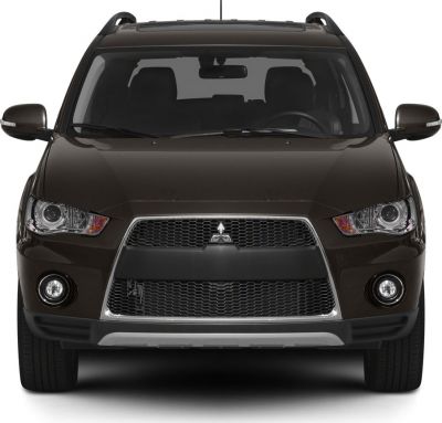 Front grille, headlights, and fog lights of an SUV.