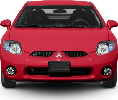 Front view with distinctive headlights, honeycomb grille, and fog lights