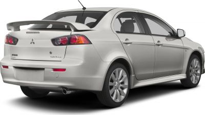 Rear view of sedan with spoiler and dual tail lights