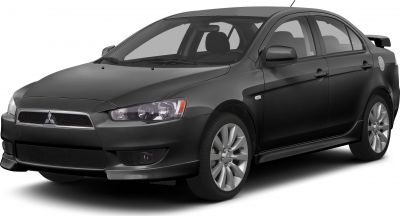 Front side view of a sporty sedan with rear spoiler and alloy wheels