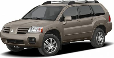 Front side view of a metallic brown mid-size SUV with roof rails and alloy wheels