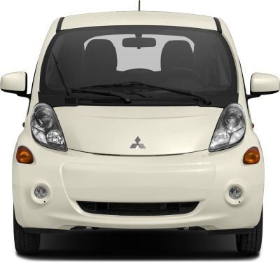 Compact electric vehicle front view with distinctive headlights and fog lights