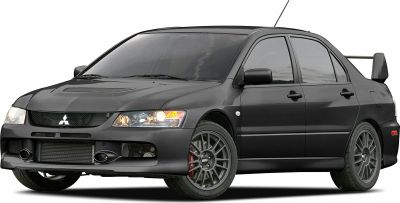 Sporty sedan front side with aggressive fascia and rear wing