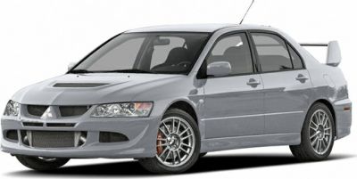 Turbocharged performance sedan with aggressive front and rear wing spoiler
