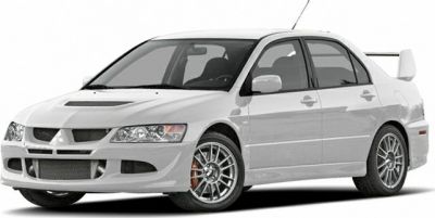 White sports sedan with aerodynamic front and alloy wheels
