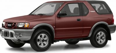 Front-side view of a red SUV with rounded headlights and robust bumper