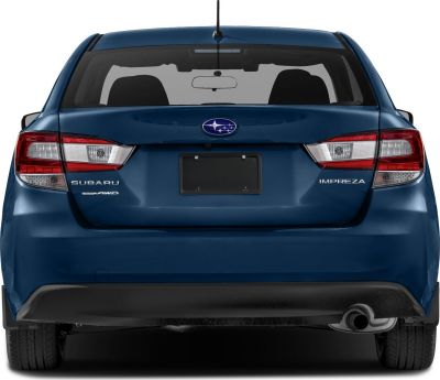 Rear sedan view with distinctive tail lights and visible exhaust pipe