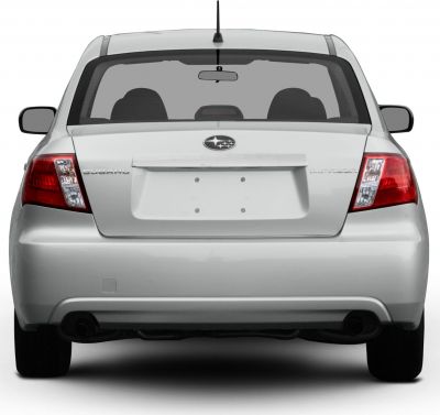 Rear view with taillights, trunk lid, bumper, and dual exhaust