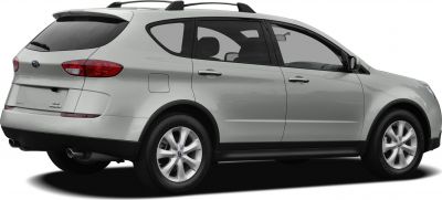 Rear side view of a silver SUV with roof rails and dual exhausts