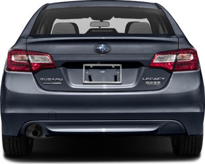 Rear view with AWD and PZEV badges, taillights, license plate frame