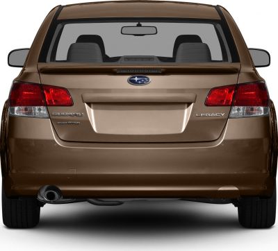 Rear view showing taillights, rear spoiler, and exhaust pipe.